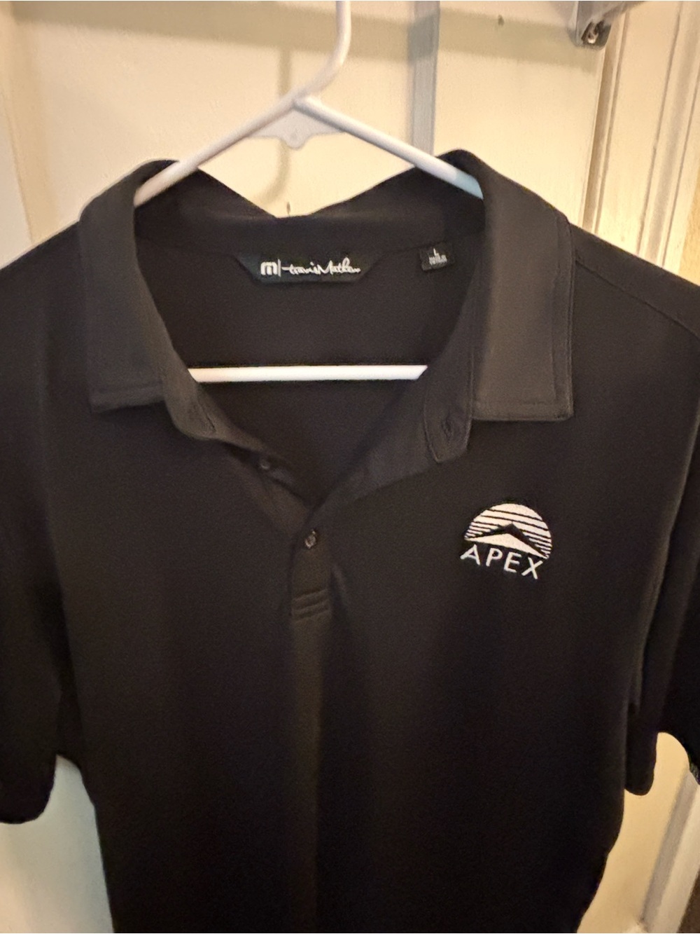 Travis Mathew Black Polo with White Back Logo